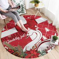 Red round Christmas rug design with large red bow, swan heart outline, and ornaments