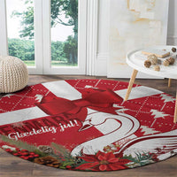 Red round Christmas rug featuring coquette bow, swan-heart illustration, poinsettia accents