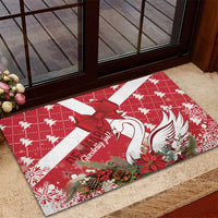 Red Christmas rubber doormat featuring white swan, red ribbon bow, and floral accents