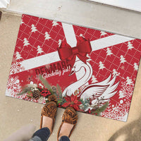 Red Christmas rubber doormat with white swan and red bow, pinecone and berry print