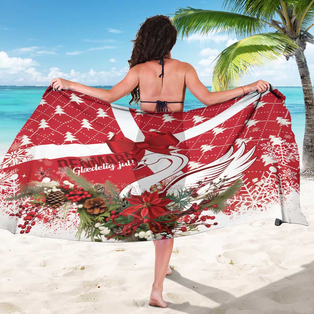 Red holiday sarong with swan motif and bow tie, worn as backless cover.