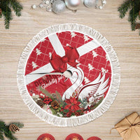 Red and white round tree skirt with red bow and fringed border, holiday swan print