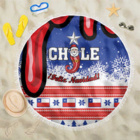 Round beach blanket with Chile Feliz Navidad Santa graphic, blue and red, white fringe