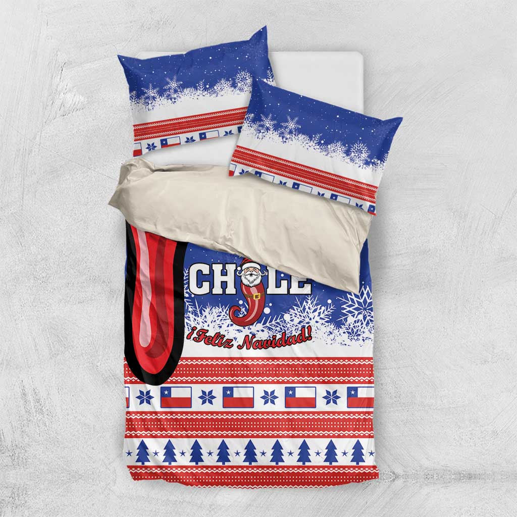 Blue Chile Christmas bedding set folded flat: duvet and two pillows with Feliz Navidad print.