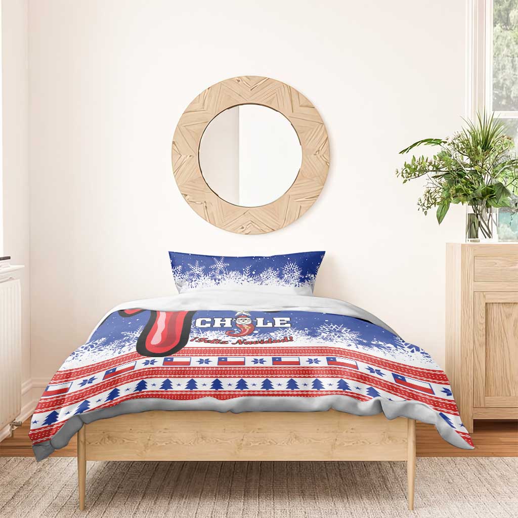 Blue Chile Christmas bedding set on wooden bed: duvet and two pillows with Chile graphic.