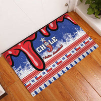 Blue doormat with Chile “Feliz Navidad” Santa figure, red swirl accents, star stripe border