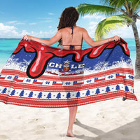 Chile Christmas sarong, blue with red swirls, snowflakes and “CHILE” centered print