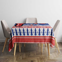 Blue and red Christmas tablecloth on dining table with matching chairs