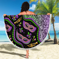 Round beach blanket with Mardi Gras mask face art in green and purple glitter, white fringe