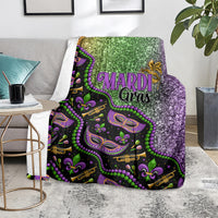 Mardi Gras blanket on living room chair, glitter green and purple with colorful mask motif