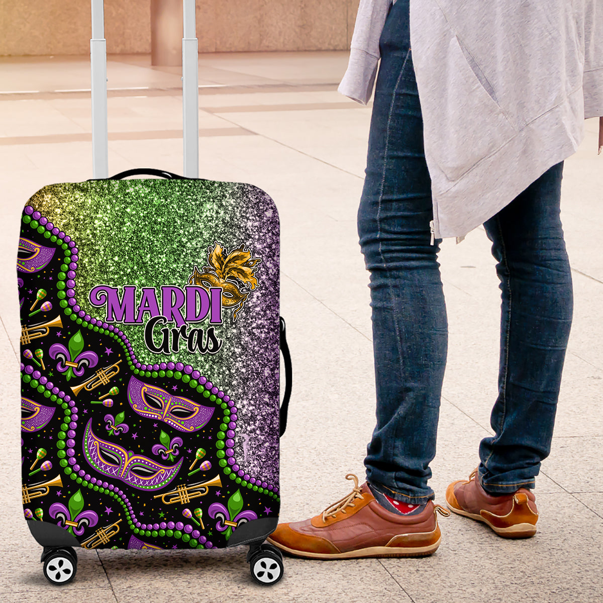 Mardi Gras themed luggage cover, purple base with green glitter mask graphics on wheels