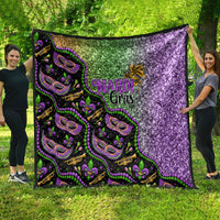 Black Mardi Gras throw quilt featuring green and purple glitter sections and mask faces