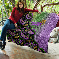 Black Mardi Gras quilt with green and purple glitter effect and colorful mask decorations