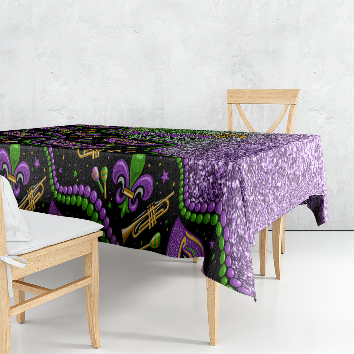 Mardi Gras tablecloth draped over table edge; black base with green beads and purple print
