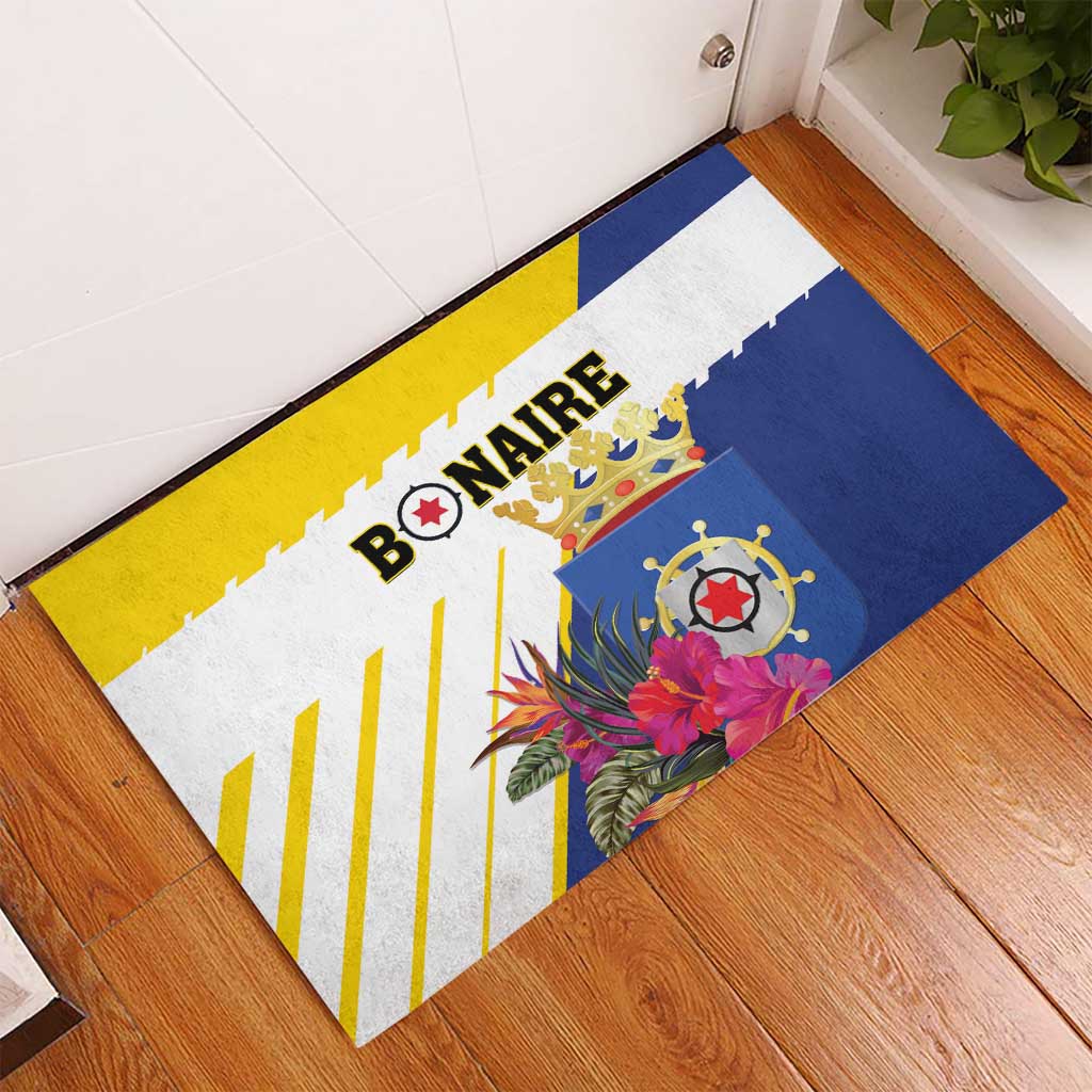 Rubber doormat featuring Bonaire logo and tropical flowers, blue yellow white striped design.