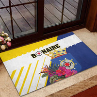 Rubber doormat with Bonaire logo and tropical flowers, blue and yellow stripe pattern.