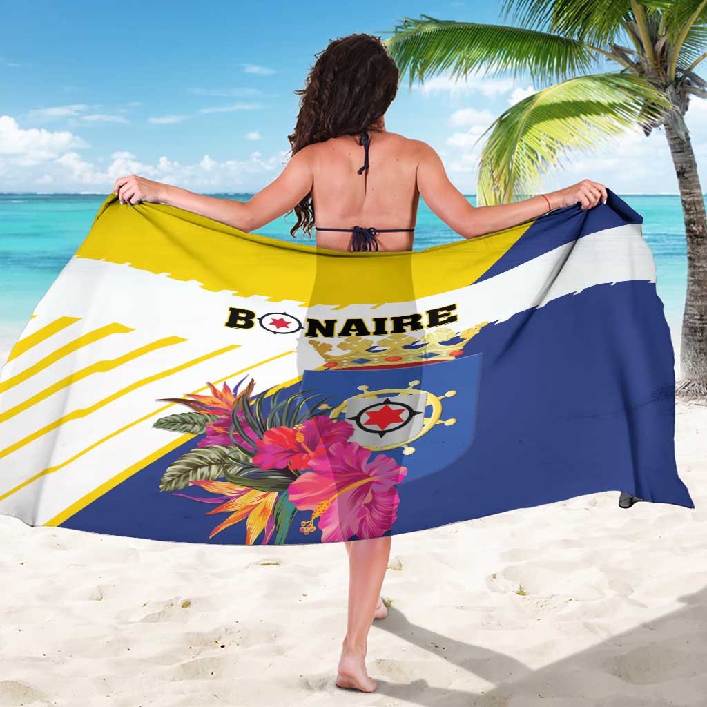 Bonaire sarong wrap with large flag graphic, tropical florals, and text