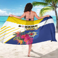 Bonaire sarong wrap with large flag graphic, tropical florals, and text