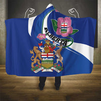 Blue hooded blanket with white edging and Alberta crest center design