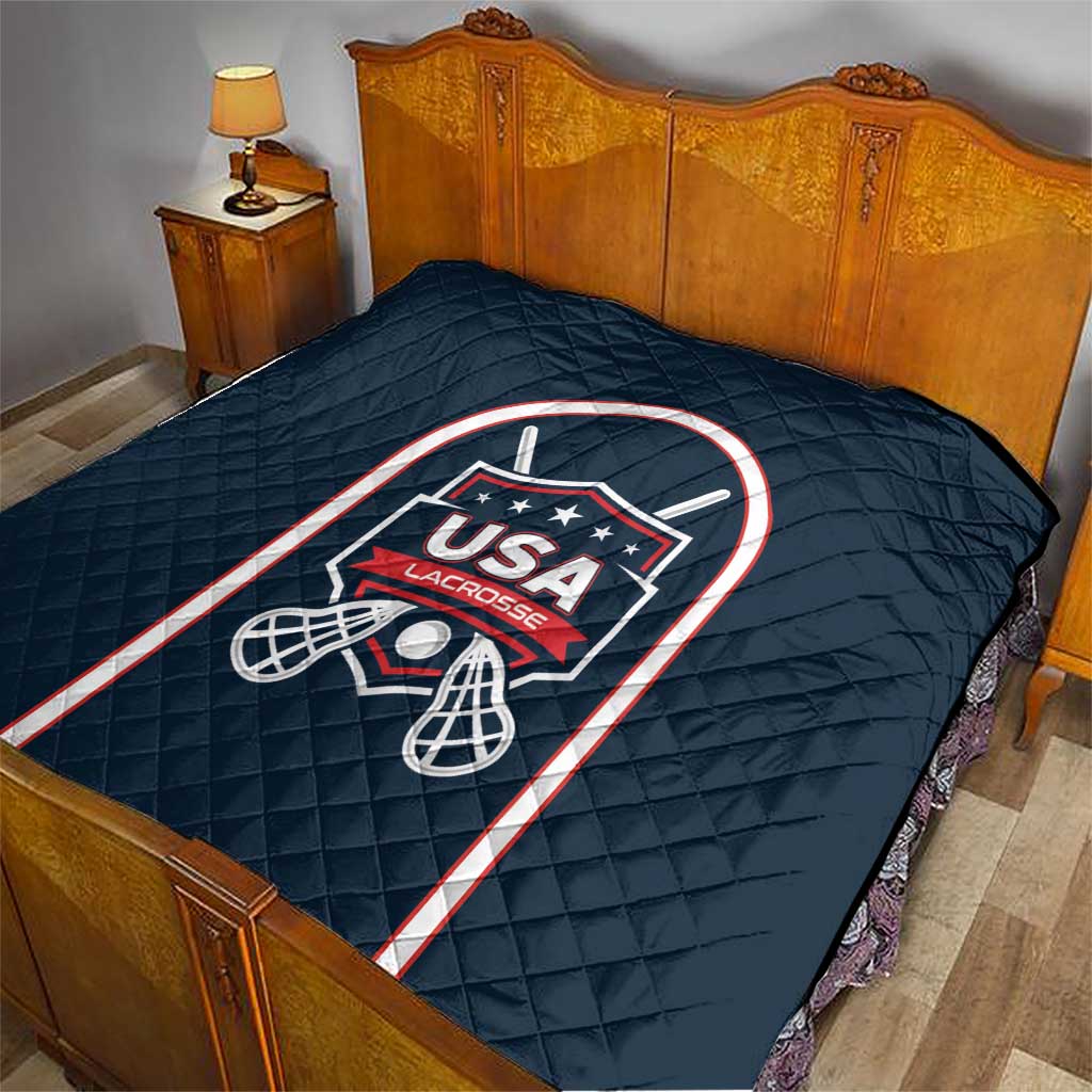 Navy blue lacrosse quilt on bed with USA Lacrosse logo and red white border