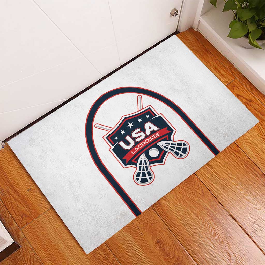White rubber lacrosse doormat featuring USA Lacrosse emblem in an arched border