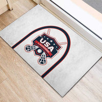 White rubber lacrosse doormat close-up of USA Lacrosse crest and lacrosse sticks