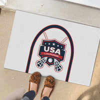 White rubber lacrosse doormat with USA Lacrosse logo, shown with shoes nearby