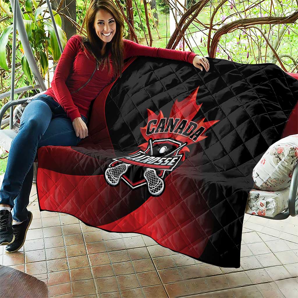 Canada Lacrosse quilt blanket draped outdoors, black and red with Canada Lacrosse emblem