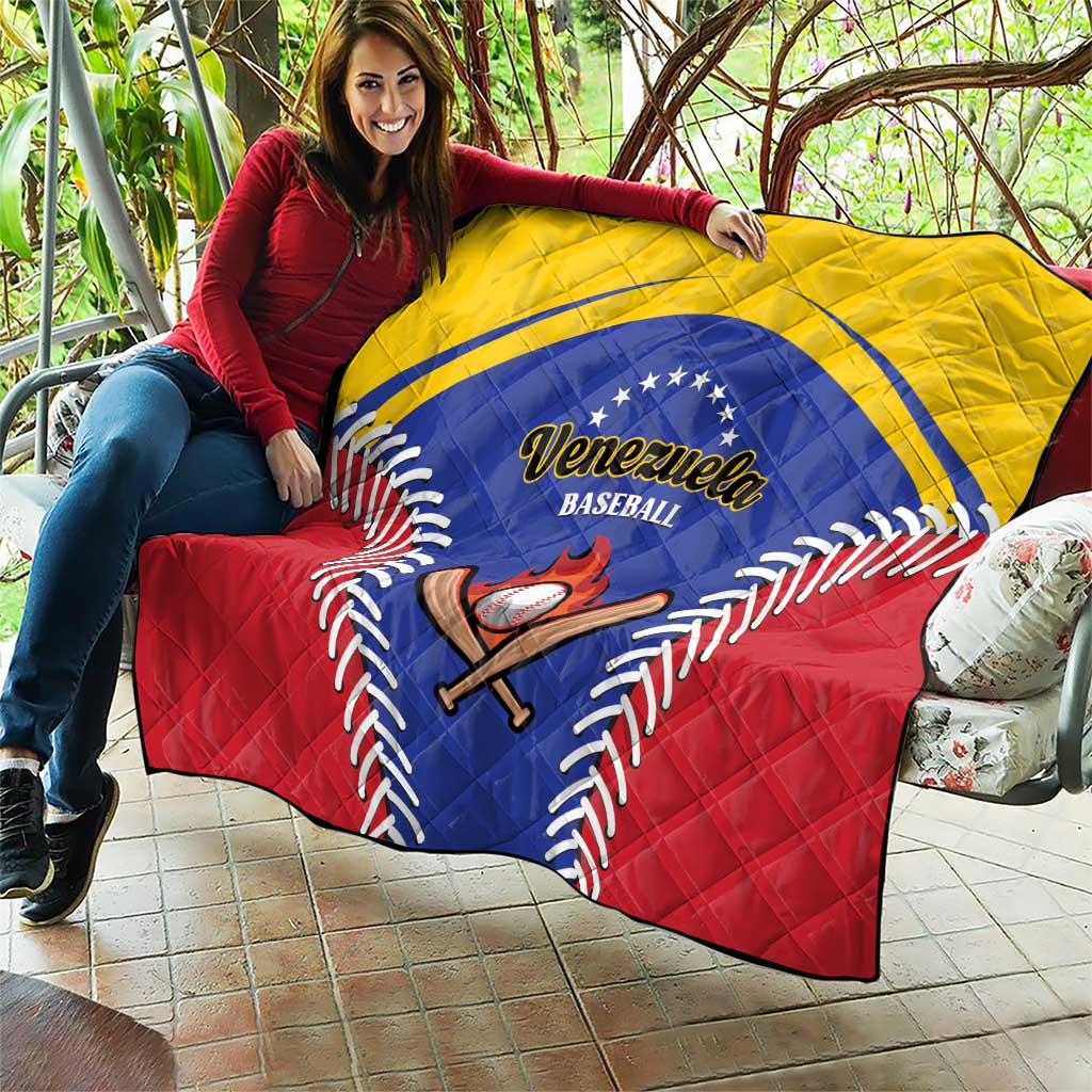 Baseball quilt blanket held on couch, Venezuela emblem with blue circle and red background