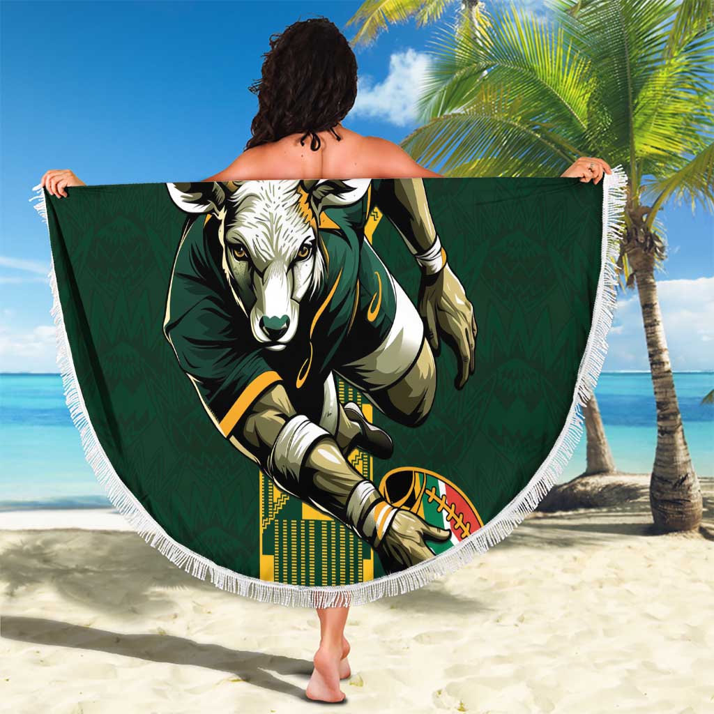 Green round beach blanket with fringe, held up showing South Africa bull graphic.