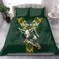 Green rugby bedding set on bed with South Africa text and antelope mascot duvet art
