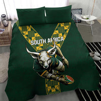 Green rugby bedding set on bed with South Africa text and antelope mascot graphic