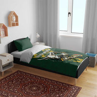 Green rugby bedding set on bed with South Africa text and antelope mascot duvet cover