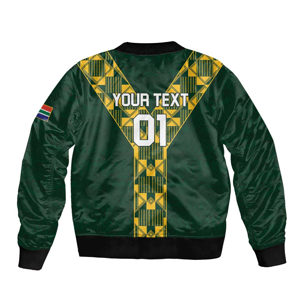Green bomber jacket back with yellow pattern, "YOUR TEXT" and "01"; SA flag sleeve patch