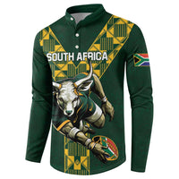 Green rugby button sweatshirt with yellow patterned shoulders and South Africa text