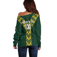 Green off-shoulder long-sleeve rugby sweater with gold geometric back graphic and text