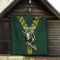 Green quilted South Africa rugby blanket hanging on a wall with V stripe logo and horned mascot