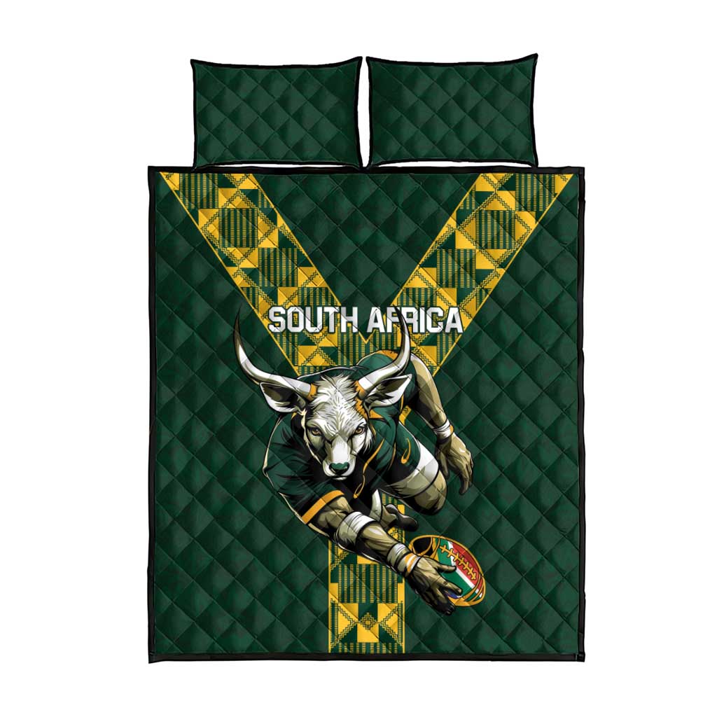 Green quilt bed set with centered South Africa text and springbok graphic, two pillowcases