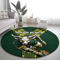 Green round rug with South Africa wordmark and charging bull mascot design with shield.