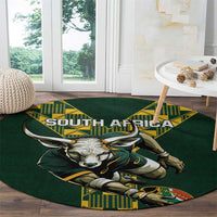 Green round rugby carpet with South Africa text and roaring bull graphic, yellow accents.