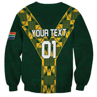 Green rugby sweatshirt with yellow geometric pattern, 'YOUR TEXT 01' print and flag patch