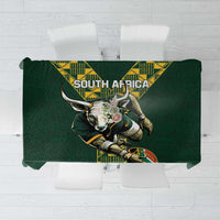 Green tablecloth featuring South Africa text and large bull emblem with yellow border