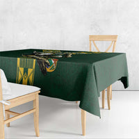Green rugby-style tablecloth with bull emblem and yellow geometric blocks