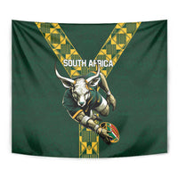 Green rugby tapestry close-up: bull mascot with ball, framed by yellow patterned V stripes