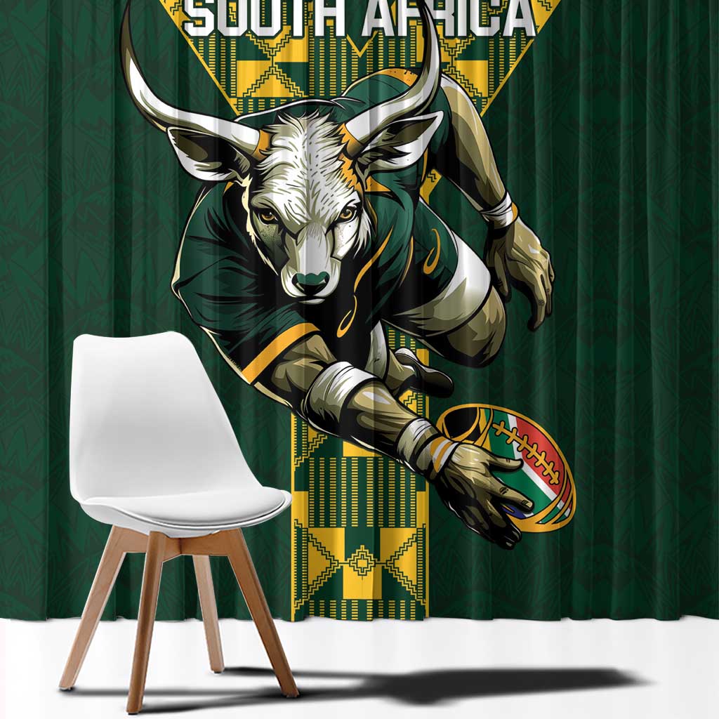 Close view of green curtain with South Africa rugby face emblem in yellow border