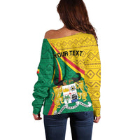 Women’s off-shoulder pullover sweater, back view, green and yellow Benin graphic