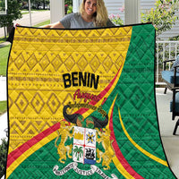 Benin independence quilt held outdoors; green and yellow flag graphics with crest