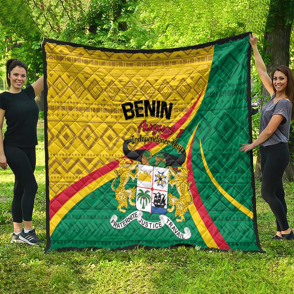 Benin-themed quilt with green, yellow, and red flag design and center crest
