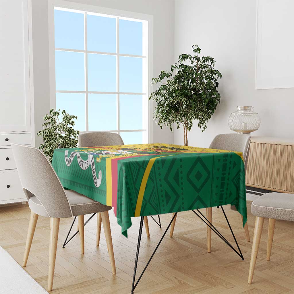 Green rectangular tablecloth with bold geometric print and yellow and blue accents