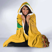 Yellow hooded blanket with white sherpa lining and Jamaica 63 graphic